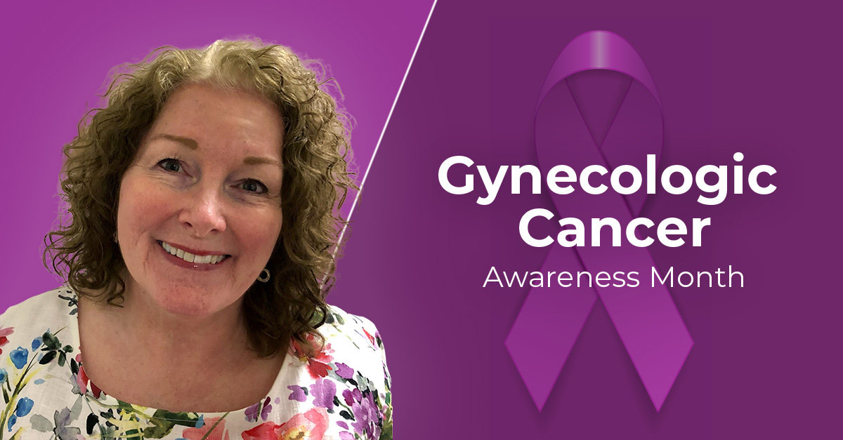 Dr. Cathy Larrimore with a purple ribbon for Gynecologic Cancer Awareness Month.