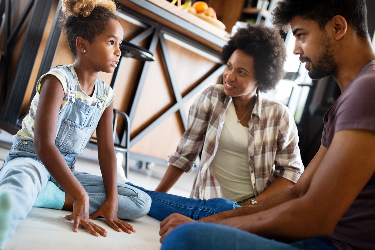 Parents having conversation with teenage child with problem solving attitude, discussing Help Teach Little Girls (and Boys) How to Take Care of Their Bodies.