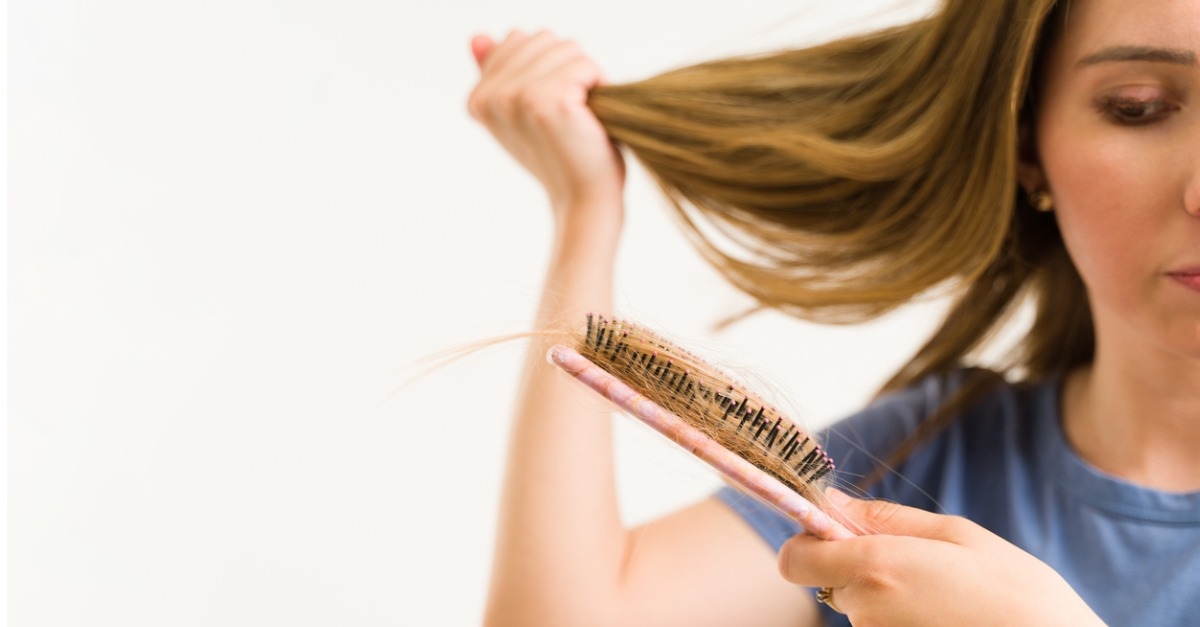 troubled woman suffering from hair loss