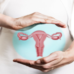 Image of a woman in a white dress and 3d model of the reproductive system of women above her hands.