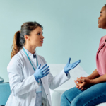 A patient speaking to her gynecologist at a medical examination.